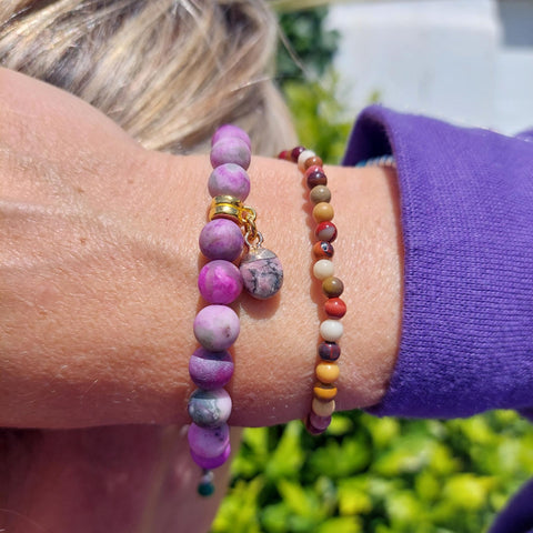 Lovely 8mm Matt Natural Stone Bead Bracelet in shades of Purple with gold plated cube charm  Elasticated, so will fit most adult wrists (measuring 7.5in/19cm)  A lovely gift for friends or family  **Presented in lovely Kraft paper gift box with reusable organza pouch**