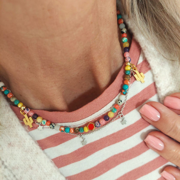 Lovely short necklace in multi colours with cute gold plated cactus & heart charms. Handmade using agate, dalmatian jasper, natural stone & gold plated hematite beads.  Gold plated fastenings & lobster clasp with gold (nickel free) star charm  Length - 40cm with extension chain to 43cm  Perfect for wearing with all your favourite Tees!