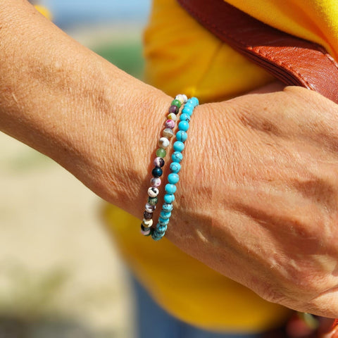 Lovely delicate handcrafted collection of 2 Beaded Surf Bracelets  Each Bracelet is individually designed one with 4mm turquoise calcite beads &amp; the second with&nbsp;4mm multi colour natural stone quartz beads. A perfect Summer combination!  Elasticated, so will fit most adult wrists (measuring 7.5 in/19cm