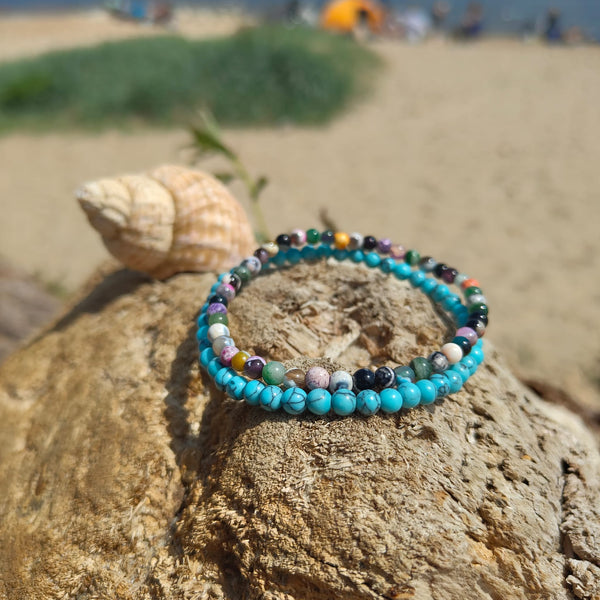 Lovely delicate handcrafted collection of 2 Beaded Surf Bracelets  Each Bracelet is individually designed one with 4mm turquoise calcite beads &amp; the second with&nbsp;4mm multi colour natural stone quartz beads. A perfect Summer combination!  Elasticated, so will fit most adult wrists (measuring 7.5 in/19cm