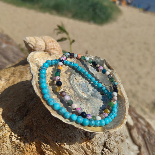 Lovely delicate handcrafted collection of 2 Beaded Surf Bracelets  Each Bracelet is individually designed one with 4mm turquoise calcite beads &amp; the second with&nbsp;4mm multi colour natural stone quartz beads. A perfect Summer combination!  Elasticated, so will fit most adult wrists (measuring 7.5 in/19cm